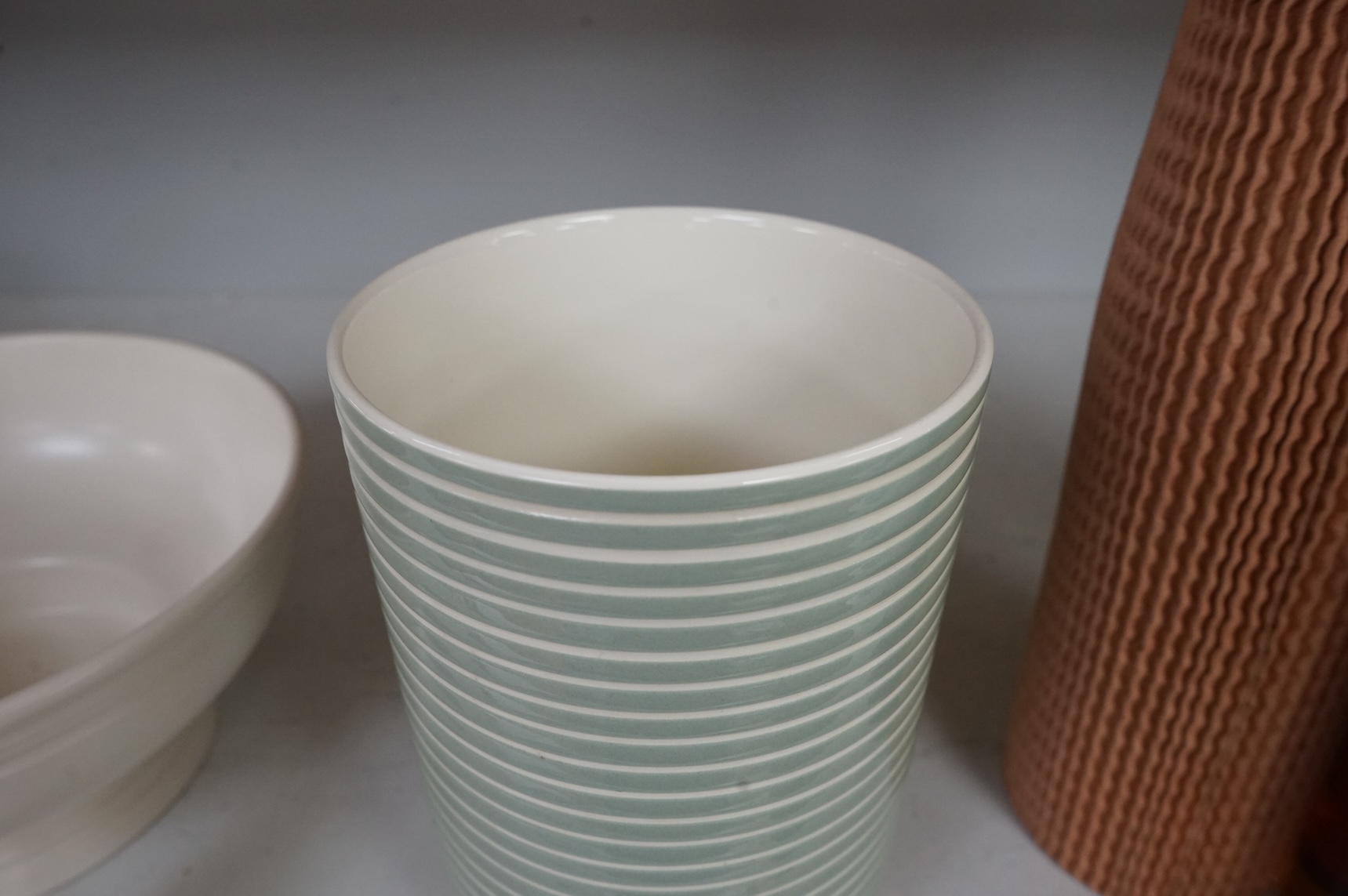 Keith Murray for Wedgwood, a green and cream vase, 18cm high